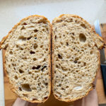 sourdough bread with orange olive oil and sesame seeds.