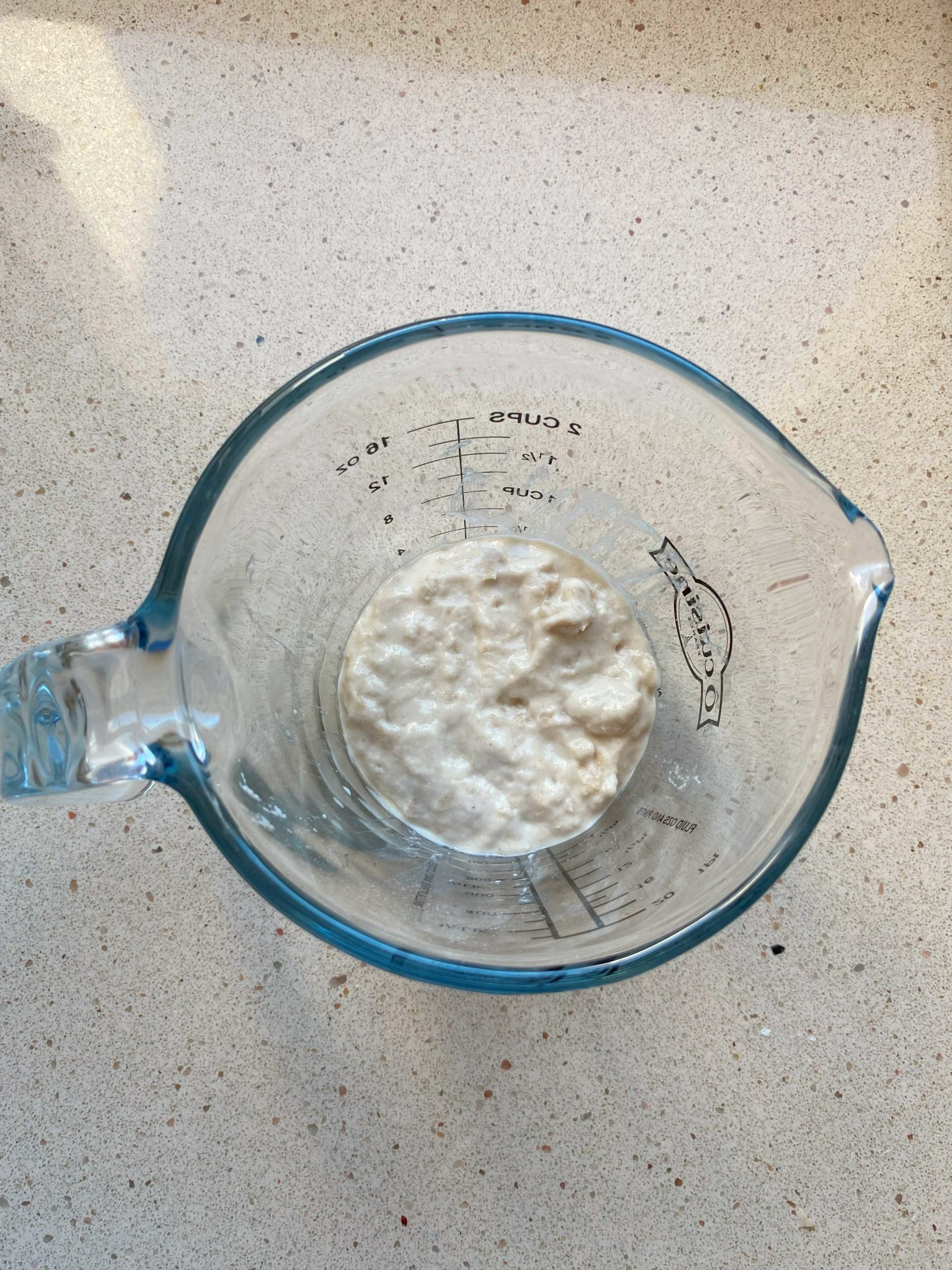 mixed sourdough starter with flour and water